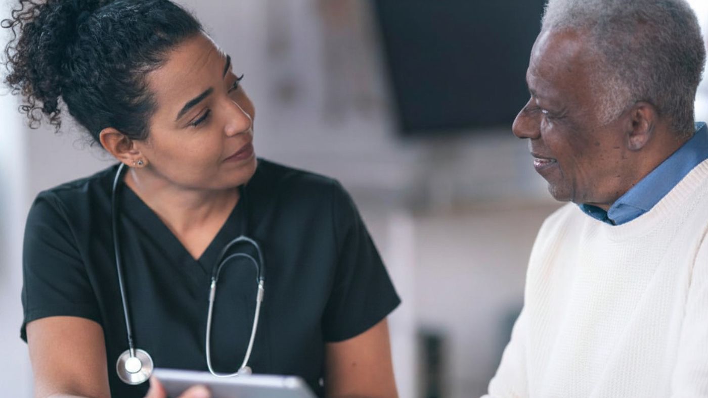 OC Wellness provider explaining personal injury care billing to a patient in Orange County.